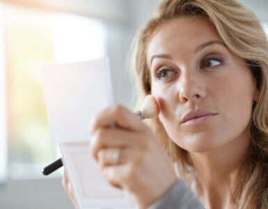 sweat-proof makeup - woman putting on makeup